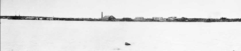 View of the sawmill area with a schooner to the left in the image.