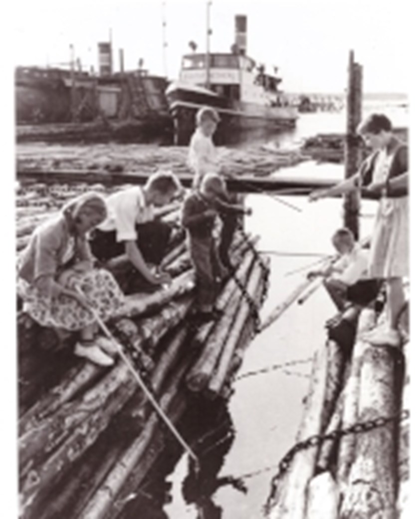 A familiy on a timber raft trying to catch their dinner fish. 
